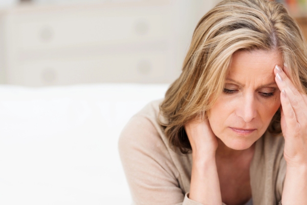 woman feeling sick depicting carbon monoxide issues and whole-house generator