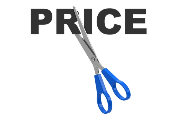 scissors cutting through the word price depicting low fuel prices in summer