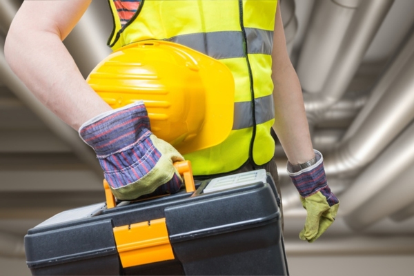 HVAC maintenance personnel depicting ductwork maintenance for durability