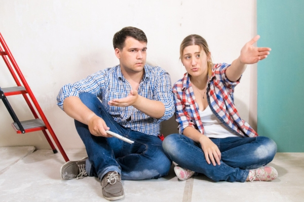 couple talking and deciding whether to replace home HVAC ductwork or not