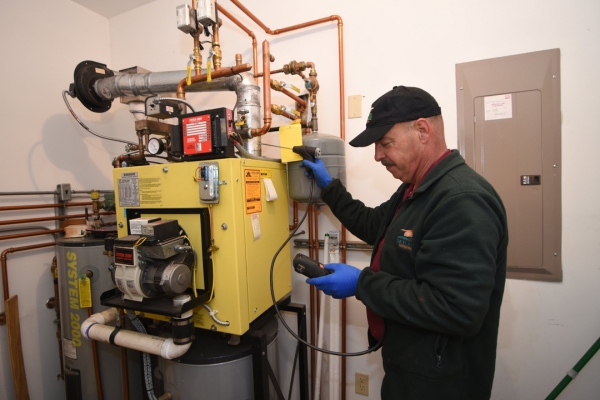 Skylands Energy Service technician doing boiler inspection for a client