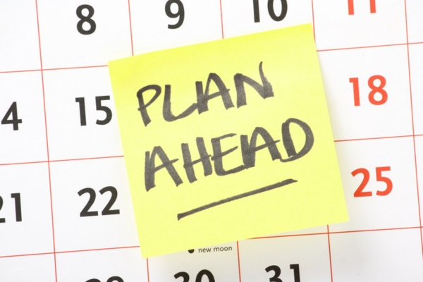 plan ahead note in front of a calendar depicting heating oil delivery