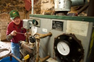 Skylands Energy Service HVAC technician servicing a client's boiler