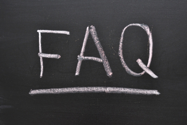 FAQ written on chalkboard depicting questions about supplemental ductless heating