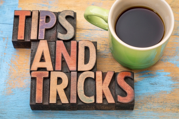 Tips and Tricks beside a coffee mug depicting ceiling fan tips for lower energy bills